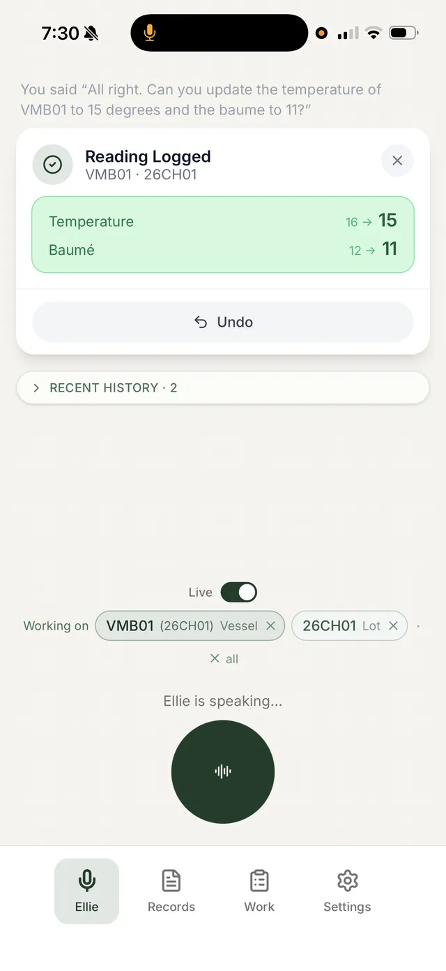 Elevage on an iPhone: after the winemaker says "update the temperature of VMB01 to 15 degrees and the baume to 11", Ellie confirms a logged reading against barrel VMB01 on lot 26CH01, showing temperature 16 to 15 and baume 12 to 11, with an undo button.